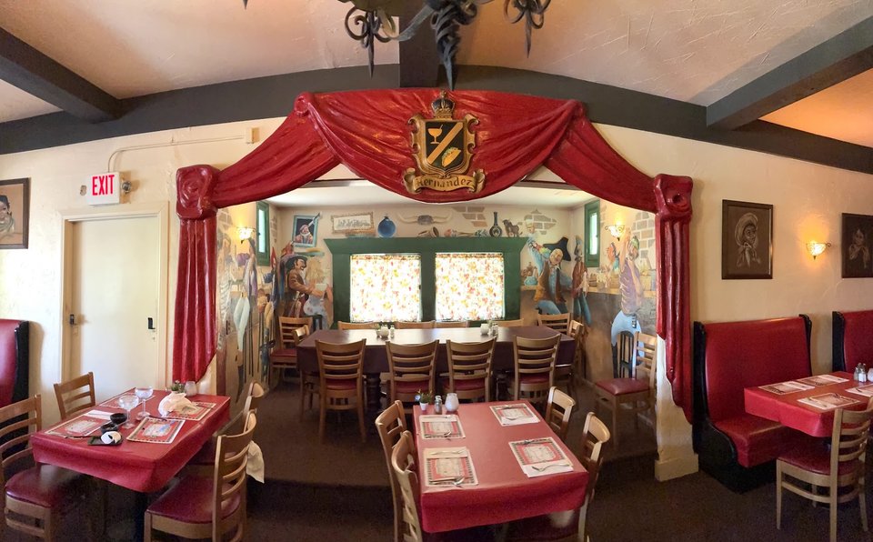 Casual Mexican restaurant dining room with table service.